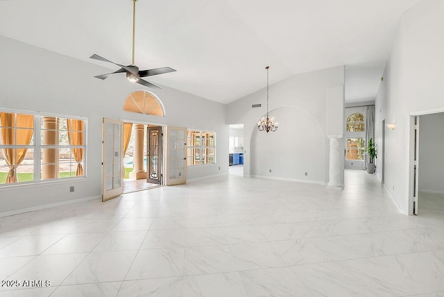 16219 S 14th Way, Phoenix, AZ 85048 - unfurnished living room with a chandelier, ornate columns, light marble finish floors, baseboards, and ceiling fan