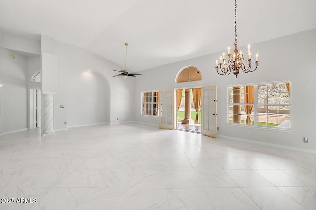 16219 S 14th Way, Phoenix, AZ 85048 - empty room with light marble finish floors, a chandelier, lofted ceiling, ornate columns, and arched walkways
