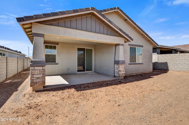 rear view of house with a patio