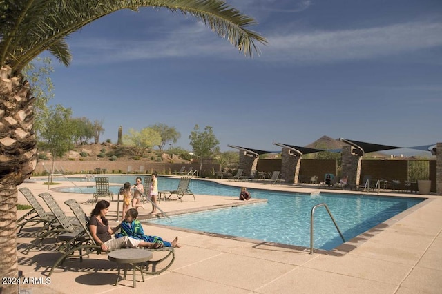 view of swimming pool featuring a patio