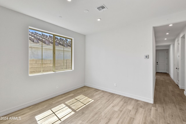 empty room with light wood-type flooring