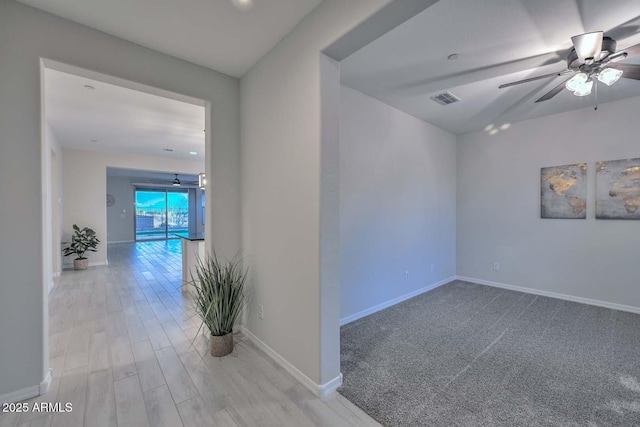 interior space featuring light hardwood / wood-style flooring and ceiling fan