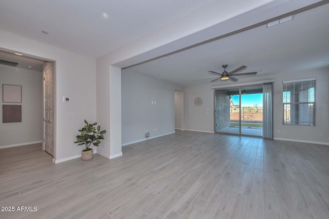 empty room featuring ceiling fan and light wood-type flooring