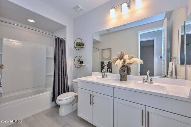 full bathroom featuring shower / bath combination with curtain, vanity, toilet, and hardwood / wood-style floors