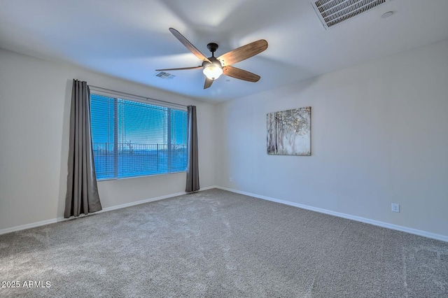 spare room with carpet floors and ceiling fan