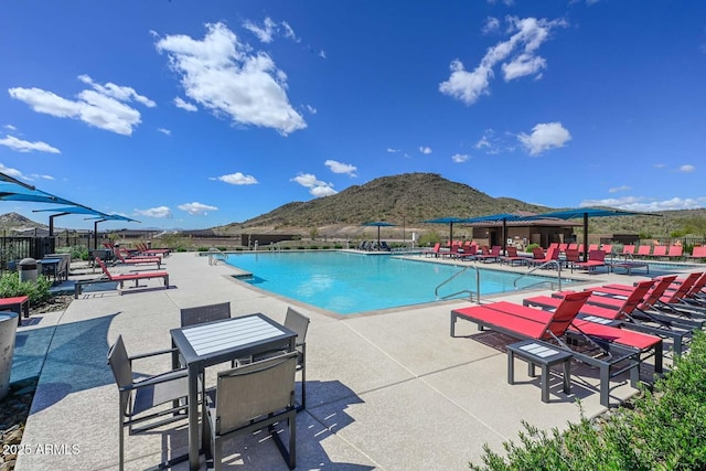 32553 N 133rd Ave, Peoria, AZ 85383 - community pool with a mountain view, fence, and a patio area