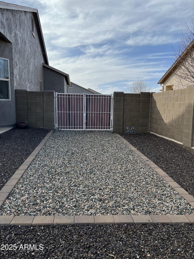 view of yard featuring a gate and fence