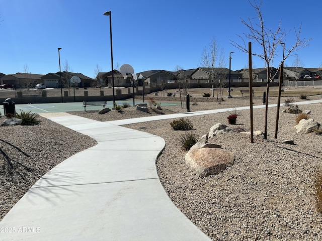 view of property's community with a residential view and community basketball court