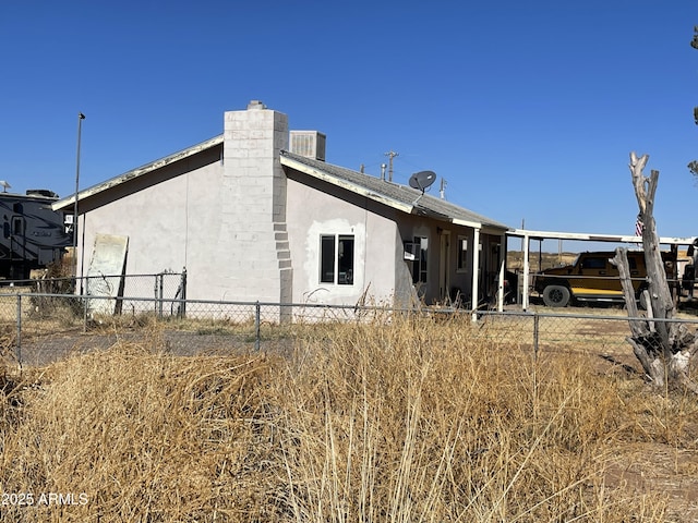 rear view of property with central air condition unit