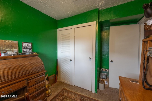 interior space with a closet and a textured ceiling