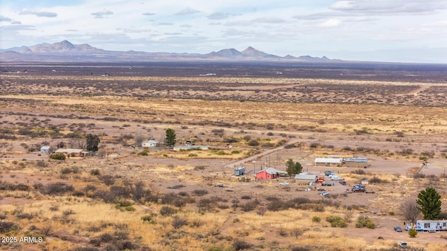 birds eye view of property with a mountain view