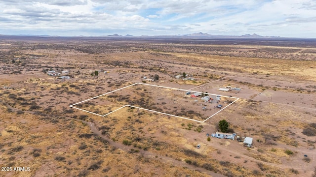 birds eye view of property featuring a mountain view