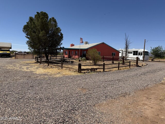 5075 W Terra Way, Mcneal, AZ 85617 - view of front facade featuring a chimney, fence, and gravel driveway
