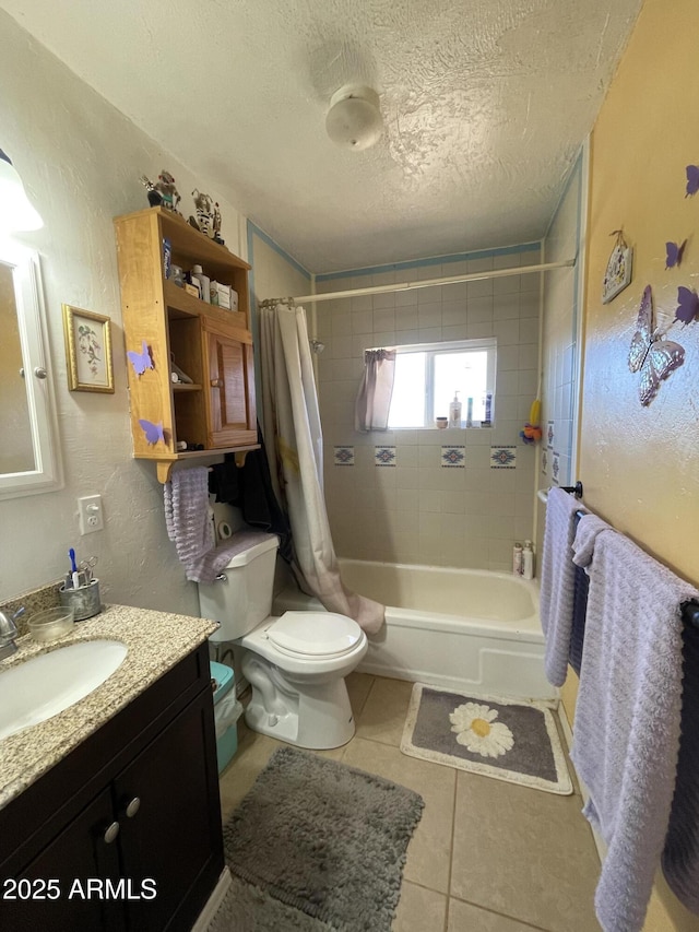 full bathroom with vanity, shower / tub combo, toilet, tile patterned floors, and a textured ceiling