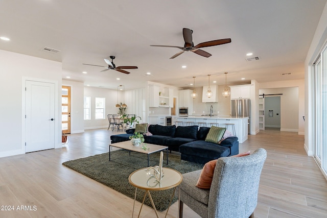3939 S Veronica Ln, Gold Canyon, AZ 85118 - living room featuring visible vents, light wood-style flooring, and a ceiling fan