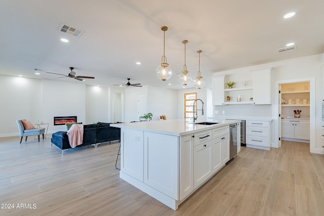 3939 S Veronica Ln, Gold Canyon, AZ 85118 - kitchen featuring stainless steel dishwasher, visible vents, light countertops, and open shelves