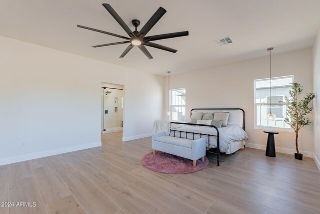 3939 S Veronica Ln, Gold Canyon, AZ 85118 - bedroom with baseboards, visible vents, ceiling fan, and light wood-type flooring