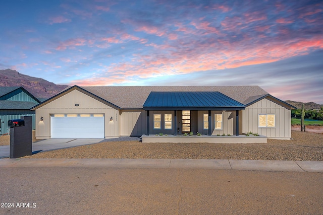 3939 S Veronica Ln, Gold Canyon, AZ 85118 - view of front of property with board and batten siding, driveway, a garage, and a mountain view
