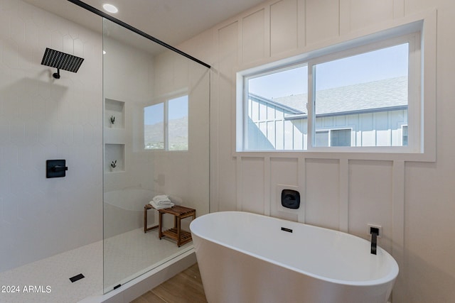 3939 S Veronica Ln, Gold Canyon, AZ 85118 - full bathroom with a decorative wall, a tile shower, wood finished floors, and a freestanding bath