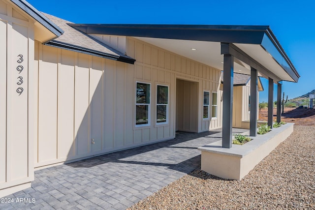 3939 S Veronica Ln, Gold Canyon, AZ 85118 - entrance to property with a patio, board and batten siding, and roof with shingles