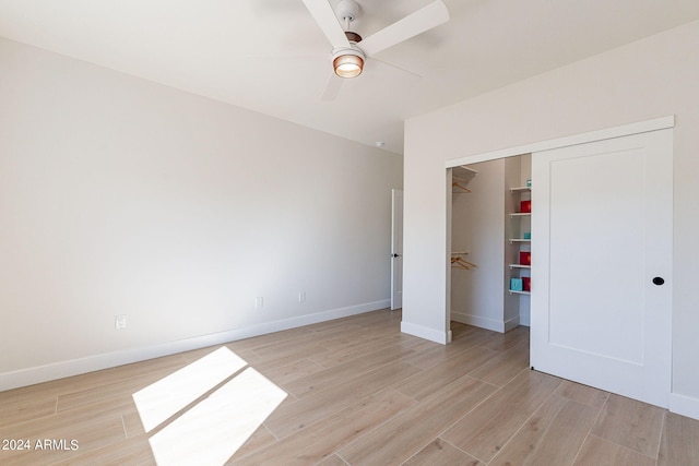3939 S Veronica Ln, Gold Canyon, AZ 85118 - unfurnished bedroom featuring a ceiling fan, baseboards, a closet, and light wood-type flooring