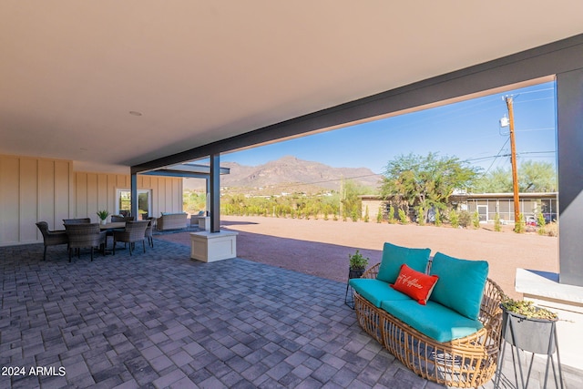 3939 S Veronica Ln, Gold Canyon, AZ 85118 - view of patio with an outdoor hangout area, a mountain view, and outdoor dining space