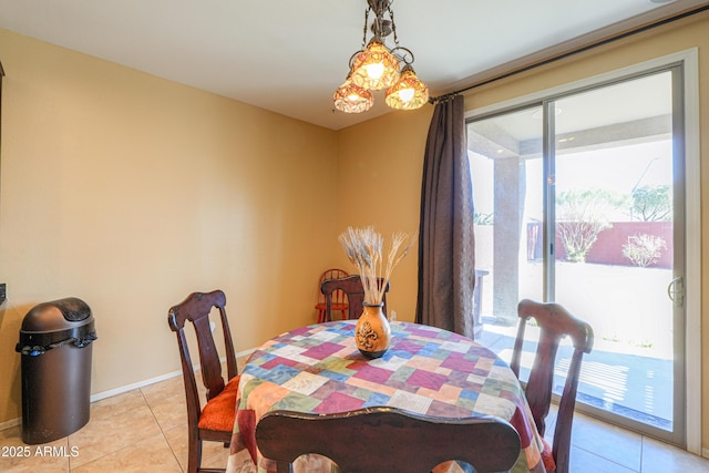 dining area with light tile patterned floors and baseboards