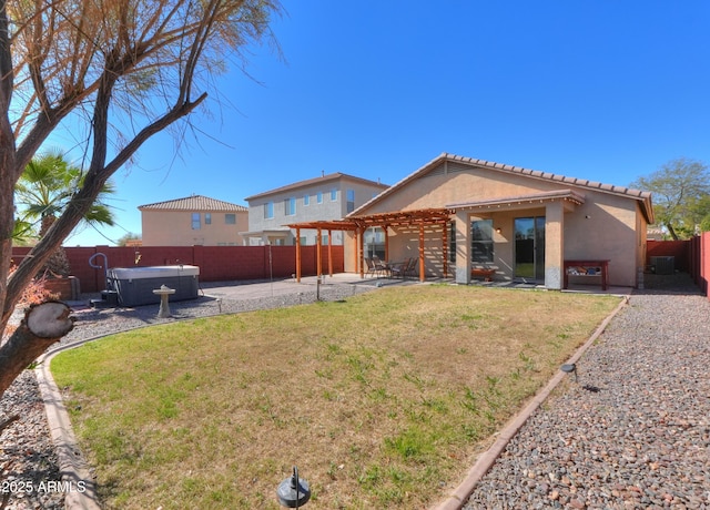 rear view of house featuring a fenced backyard, a patio, a hot tub, and a pergola