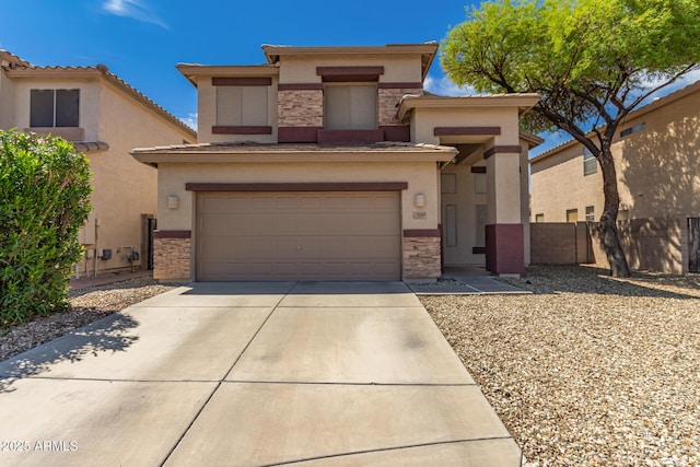 view of front of house featuring stucco siding, stone siding, and concrete driveway