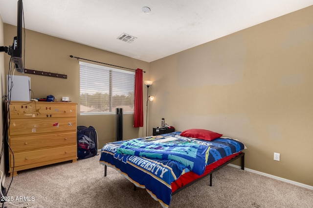 bedroom with carpet flooring, baseboards, and visible vents