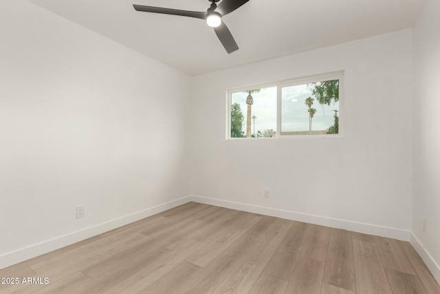 empty room featuring ceiling fan and light wood-type flooring