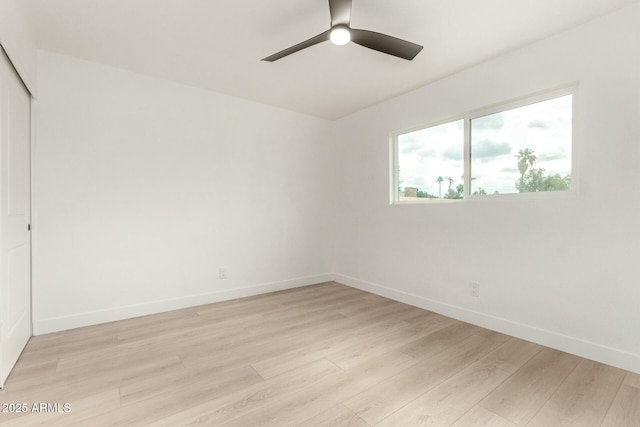 spare room with ceiling fan and light hardwood / wood-style flooring