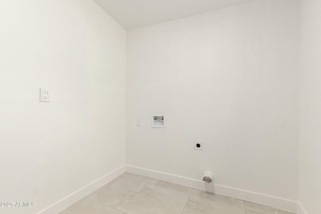 washroom featuring electric dryer hookup, light tile patterned floors, and hookup for a washing machine