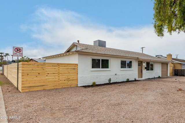 single story home with a garage