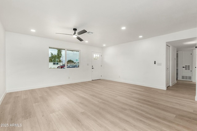 empty room with light hardwood / wood-style floors and ceiling fan