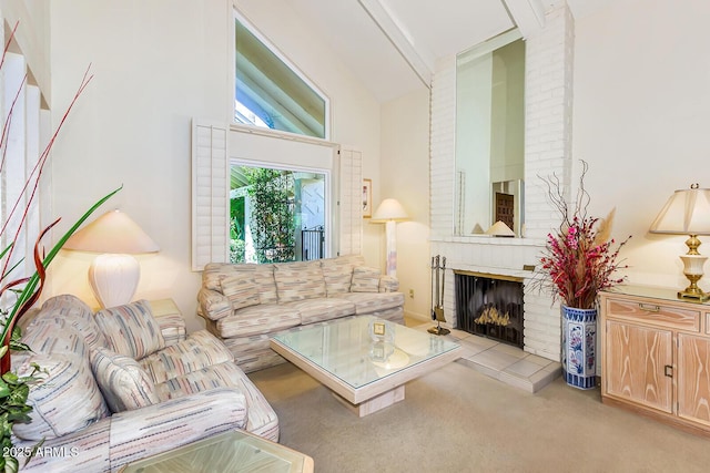 7115 E Buena Terra Way, Paradise Valley, AZ 85253 - carpeted living area with high vaulted ceiling and a brick fireplace