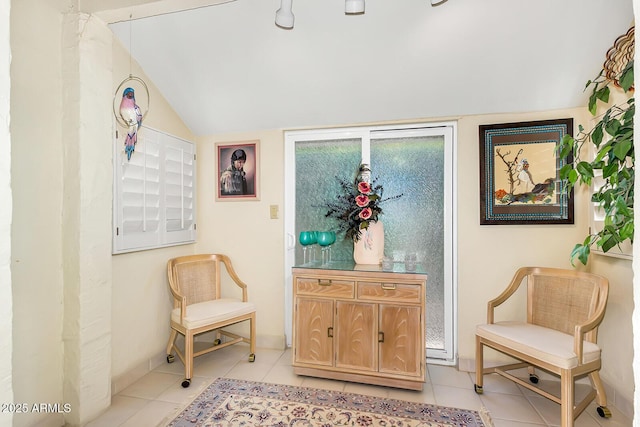 7115 E Buena Terra Way, Paradise Valley, AZ 85253 - sitting room with vaulted ceiling, light tile patterned floors, and baseboards