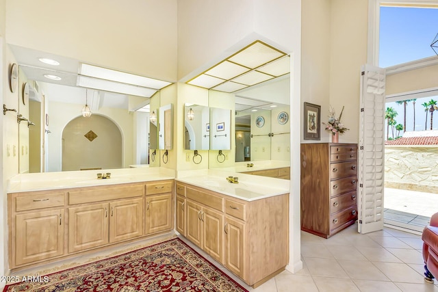 7115 E Buena Terra Way, Paradise Valley, AZ 85253 - full bathroom featuring a towering ceiling, double vanity, tile patterned flooring, and recessed lighting