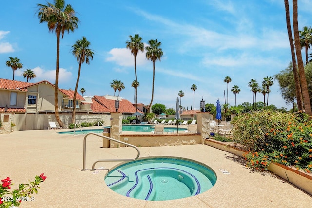 7115 E Buena Terra Way, Paradise Valley, AZ 85253 - community pool featuring a hot tub and a patio