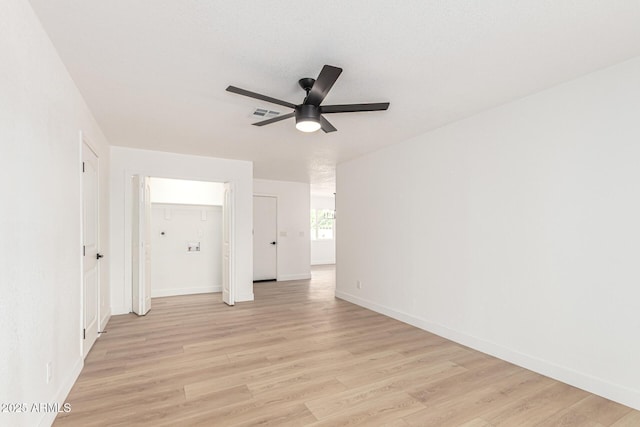 524 S Pioneer, Mesa, AZ 85204 - empty room featuring a ceiling fan, light wood finished floors, and baseboards