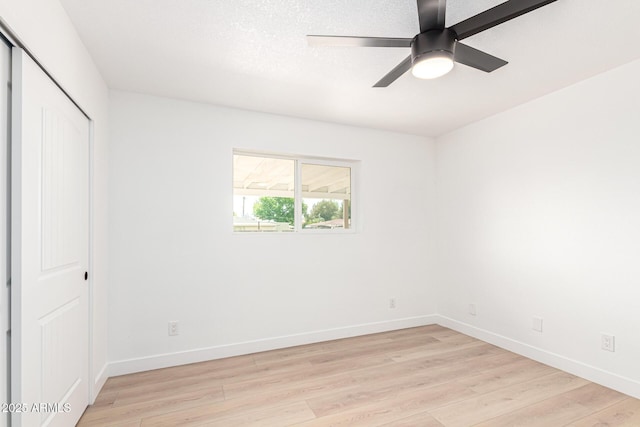 524 S Pioneer, Mesa, AZ 85204 - unfurnished bedroom with light wood-style floors, baseboards, a closet, and ceiling fan