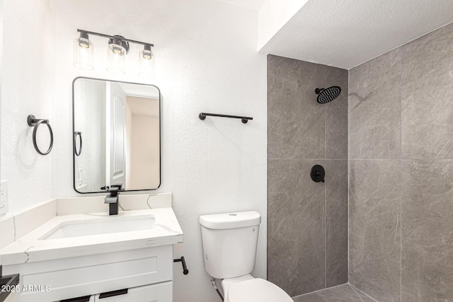 524 S Pioneer, Mesa, AZ 85204 - bathroom with tiled shower, toilet, vanity, and a textured ceiling