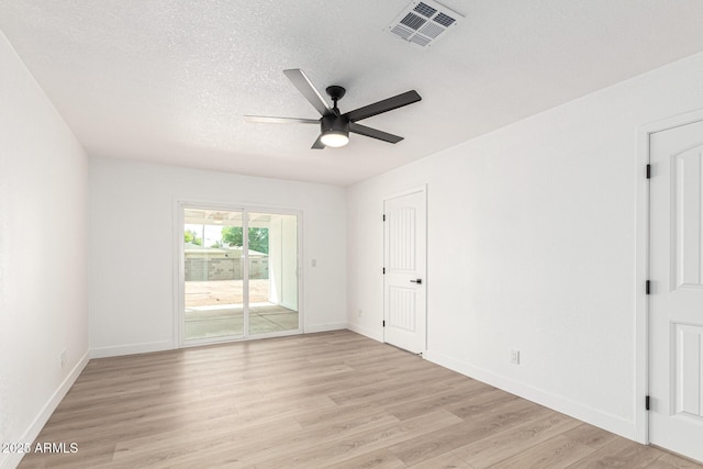 524 S Pioneer, Mesa, AZ 85204 - unfurnished bedroom featuring access to outside, light wood-style floors, baseboards, a textured ceiling, and ceiling fan