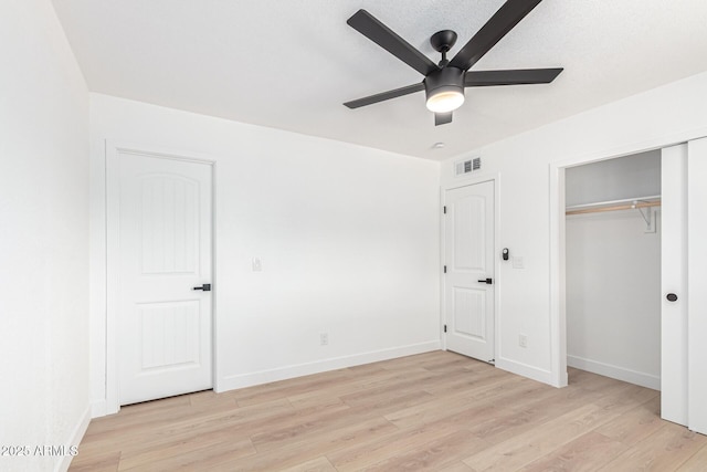 524 S Pioneer, Mesa, AZ 85204 - unfurnished bedroom featuring light wood-style flooring, baseboards, a closet, and a ceiling fan
