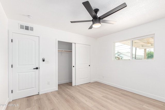 524 S Pioneer, Mesa, AZ 85204 - unfurnished bedroom with light wood finished floors, baseboards, a closet, and ceiling fan