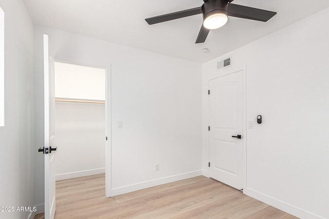 524 S Pioneer, Mesa, AZ 85204 - unfurnished bedroom with light wood-style flooring, baseboards, a closet, and a ceiling fan