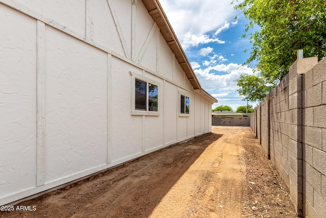 524 S Pioneer, Mesa, AZ 85204 - view of side of home with fence and board and batten siding