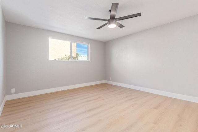 spare room featuring ceiling fan and light hardwood / wood-style flooring