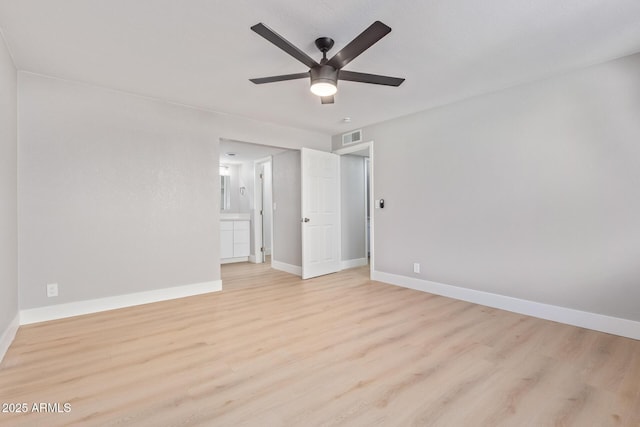 unfurnished bedroom featuring ceiling fan, ensuite bath, and light hardwood / wood-style flooring