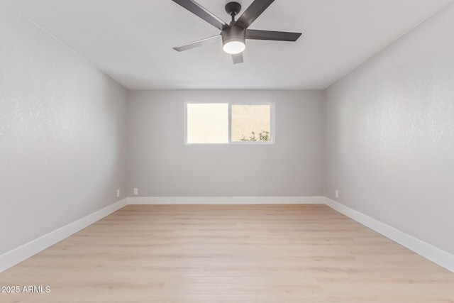 unfurnished room featuring ceiling fan and light wood-type flooring